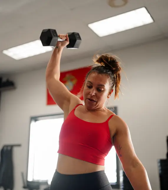 Mohawk Valley Wellness woman lifting weights